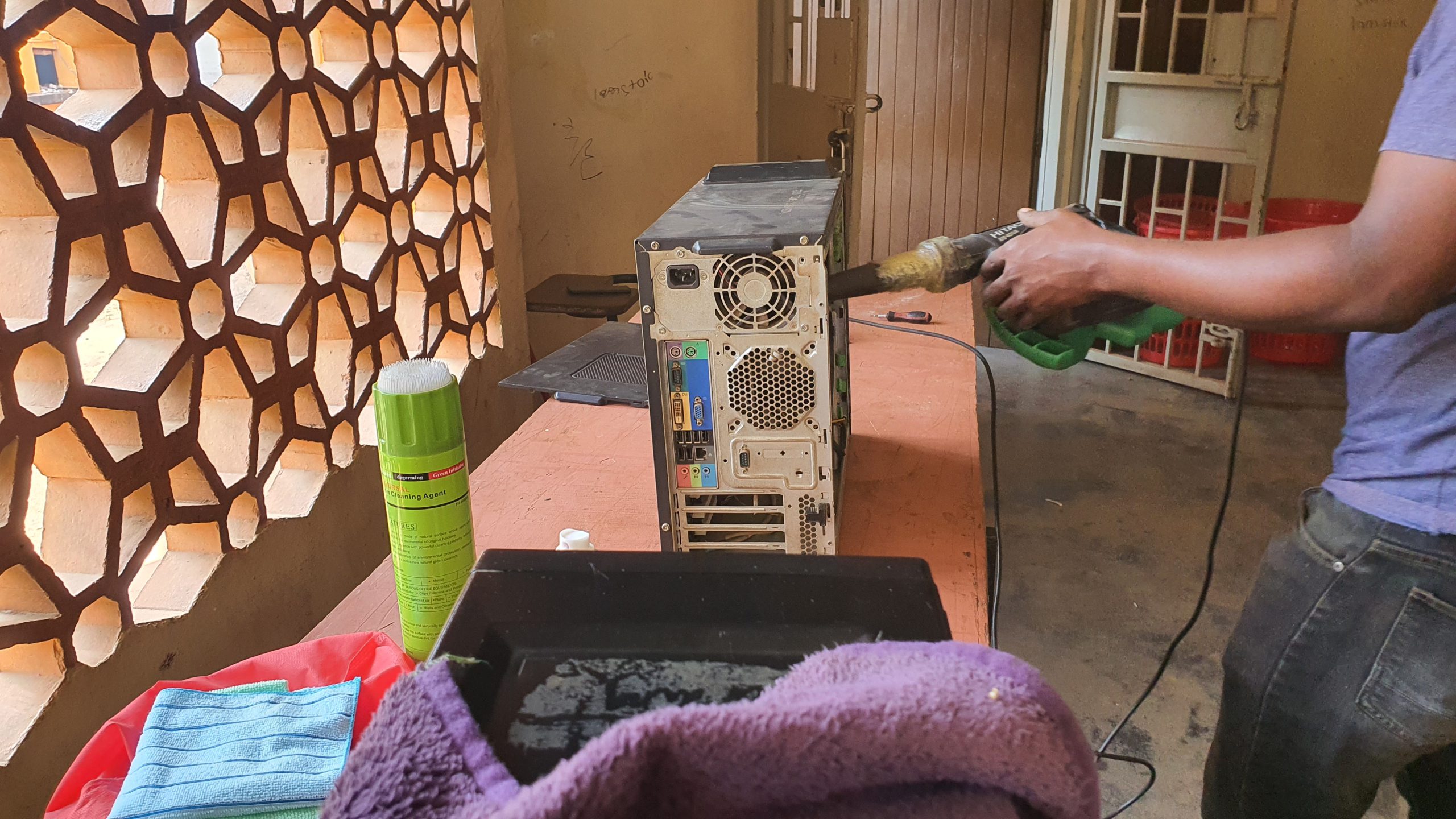 Preventive maintenance at Makerere College School Computer Lab...